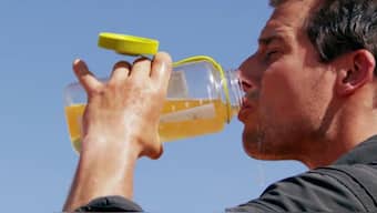 British adventurer Bear Grylls drinking his urine on his programme. 