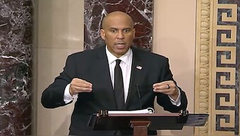 Senator Cory Booker speaks on the Senate floor. His speech against US President Donald Trump pushed past the 25-hour mark, breaking the previous record. AP