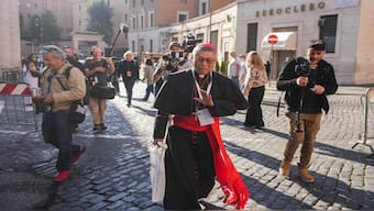 Chinese cardinal Stephen Chow Sau-Yan (C) arrives for the seventh congregation meeting at The Vatican. Cardinals from around the world dine in the quiet streets of the Borgo district on the outskirts of Vatican City. AFP