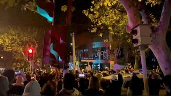 File image. People protest against coronavirus disease (COVID-19) curbs, at the site of a candlelight vigil for victims of the Urumqi fire, in Shanghai, China, in this screengrab from a video realeased on November 27, 2022. Source: Reuters