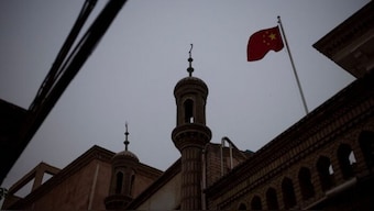 The Chinese national flag flies over a mosque in the old city in Kashgar, Xinjiang Uyghur Autonomous Region, China, May 4, 2021. Picture taken May 4, 2021. Source: Reuters