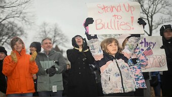 Demonstrators rally on Cambridge Common in a protest organised by the City of Cambridge calling on Harvard leadership to resist interference at the university by the federal government in Cambridge. Following Harvard's non-compliance, the Trump administration announced a $2.2 billion funding freeze and the US president also threatened the tax-exempt status. Reuters