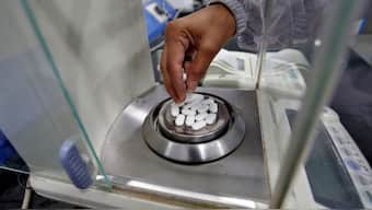 A pharmacist checks weight of paracetamol, a common pain reliever also sold as acetaminophen, tablets inside a lab of a pharmaceutical company on the outskirts of Ahmedabad. Representaitve Image