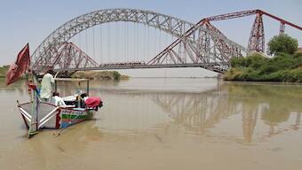 People take a boat ride in the waters of Indus River near the Lansdowne Bridge in Sukkur, in the southern Sindh province. Pakistan's move to challenge the suspension of the Indus Waters Treaty is unlikely to bear any positive results for Islamabad. AFP