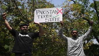 Protesters hold placards during a protest march towards the Pakistan High Commission condemning the Pahalgam tourist attack, in New Delhi. AFP