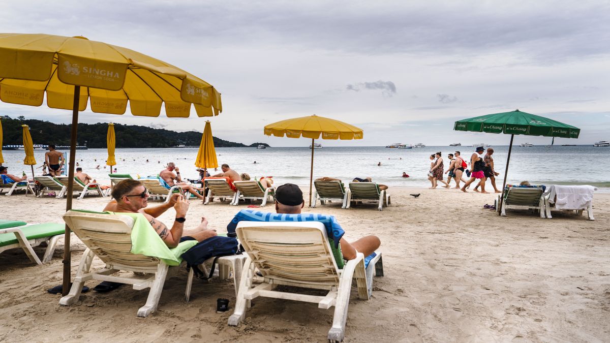 Tourists relax along Patong Beach on the southern Thai island of Phuket. Thailand's residency by investment programmes are among the best in the world as judged by Henley & Partners. File image/AFP Tourists relax along Patong Beach on the southern Thai island of Phuket. Thailand's residency by investment programmes are among the best in the world as judged by Henley & Partners. File image/AFP