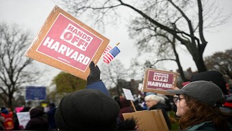Demonstrators rally on Cambridge Common in a protest organised by the City of Cambridge calling on Harvard leadership to resist interference at the university by the federal government in Cambridge, Massachusetts, US. On Monday, the Trump administration announced a federal funding freeze in response to the university not adhering to the government's demands. Reuters