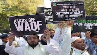 People hold placards during a protest by the All India Muslim Personal Law Board (AIMPLB) against the Waqf (Amendment) Bill at Jantar Mantar, in New Delhi. PTI