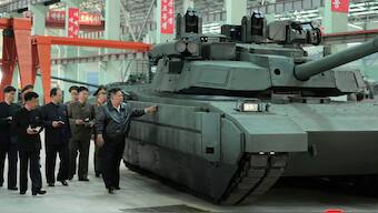 North Korea's leader Kim Jong Un touches tank armour as he tours a military equipment facility at an unspecified location in North Korea, in this image released May 4, 2025 by the Korean Central News Agency. Reuters