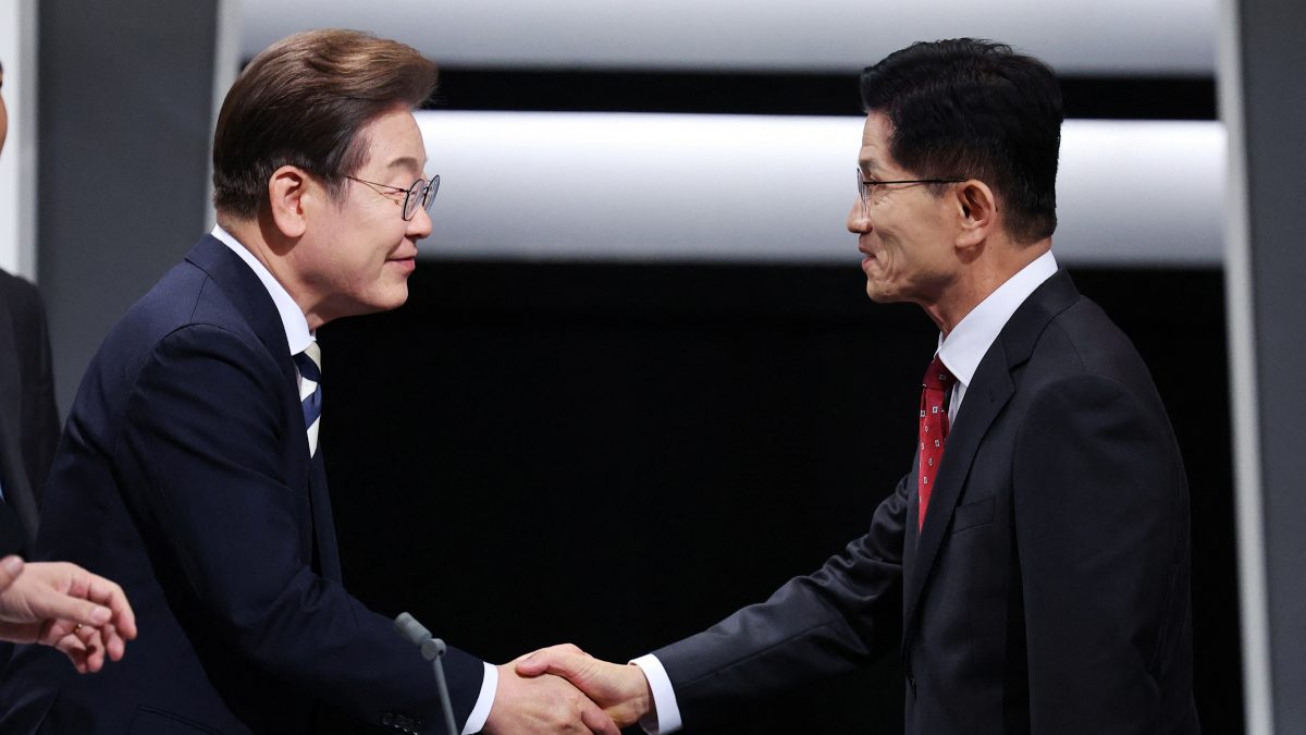 South Korea's presidential candidates Kim Moon-soo of the People Power Party shakes hands with Lee Jae-myung of the Democratic Party prepare for the second televised debate for the upcoming presidential election in Seoul, South Korea. Reuters South Korea's presidential candidates Kim Moon-soo of the People Power Party shakes hands with Lee Jae-myung of the Democratic Party prepare for the second televised debate for the upcoming presidential election in Seoul, South Korea. Reuters