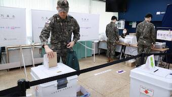 A South Korean soldier casts his early vote for the upcoming presidential election at a polling station in Seoul, South Korea. Reuters