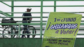 A man pushes his bicycle as an electoral propaganda banner hangs from a pedestrian bridge encouraging people to vote, ahead of the judicial and magistrate election, in Mexico City, Mexico. Reuters