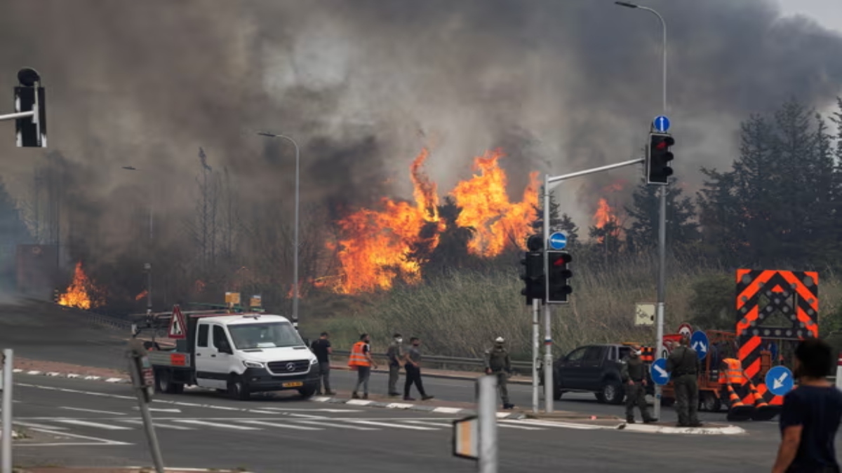 Israeli security and rescue personnel work near Latrun in central Israel on Wednesday, as wildfires due to extreme heat and winds broke out in central Israel. Reuters Israeli security and rescue personnel work near Latrun in central Israel on Wednesday, as wildfires due to extreme heat and winds broke out in central Israel. Reuters