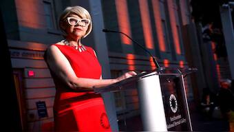 National Portrait Gallery Director Kim Sajet speaks at an exhibition opening in 2022. AP
