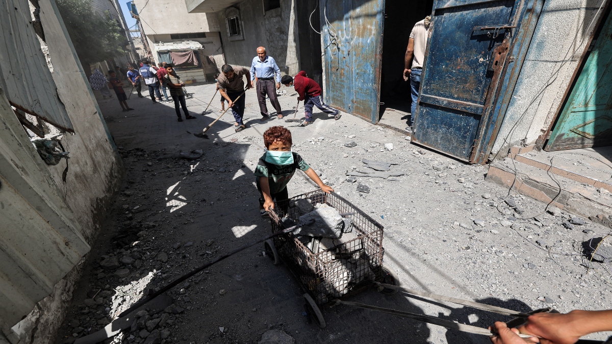 A man and boy transport a cart loaded with rubble to be scrapped from the scene following Israeli bombardment in the Bureij camp for Palestinian refugees in the central Gaza Strip on May 23, 2025. AFP A man and boy transport a cart loaded with rubble to be scrapped from the scene following Israeli bombardment in the Bureij camp for Palestinian refugees in the central Gaza Strip on May 23, 2025. AFP
