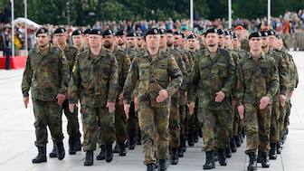 German soldiers march at a formal inauguration of a German brigade for NATO's eastern flank in Vilnius. AP