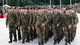 German soldiers march at a formal inauguration of a German brigade for Nato's eastern flank in Vilnius. AP