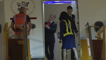 In this grab taken from video, France's President Emmanuel Macron prepares to disembark a plane on arrival, in Hanoi, Vietnam. AP