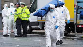 Forensic officers prepare equipment near the site where a 53-year-old British man plowed a minivan into a crowd of Liverpool soccer fans who were celebrating the city's Premier League championship Monday. There have been at least nine such major incidents in Europe since 2009. AP