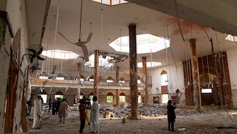 Members of the media film the inside of a building after it was hit by an Indian strike in Bahawalpur, Pakistan on May 7, 2025. Reuters