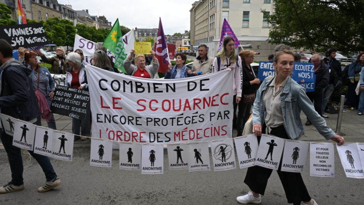 Protestors hold signs bearing the names of the victims and a banner reading 'how many Le Scouarnec are still protected by the medical board' (C) during a demonstration in support of victims at the courthouse on the sidelines of retired surgeon Joel Le Scouarnec's trial in Vannes, northwestern France, on May 28, 2025. (Photo: AFP) Protestors hold signs bearing the names of the victims and a banner reading 'how many Le Scouarnec are still protected by the medical board' (C) during a demonstration in support of victims at the courthouse on the sidelines of retired surgeon Joel Le Scouarnec's trial in Vannes, northwestern France, on May 28, 2025. (Photo: AFP)