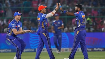 Mumbai Indians captain Hardik Pandya celebrates with Suryakumar Yadav and Corbin Bosch after dismissing Rajasthan Royals middle-order batter Shubham Dubey. AP