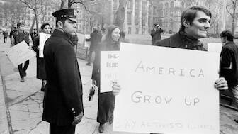 Demonstrators pass a security guard in New York City during gay rights protests. File image/AP