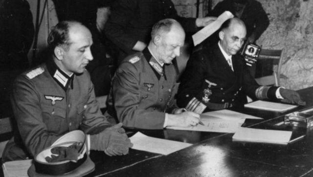 General Alfred Jodl signs the surrender of all German forces in Rheims, France. He is flanked by Wilhelm Oxenius (left) of the Luftwaffe and Hans-Georg von Friedeburg, representing Germany’s navy. File image/AP