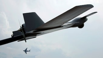 A Boeing C-17 Globemaster III military transport aircraft of the United States Air Force (USAF) flies past a Harop unmanned combat air vehicle (UCAV) during an aerial display at the Singapore Airshow in Singapore, February 17, 2012. File Image/Reuters