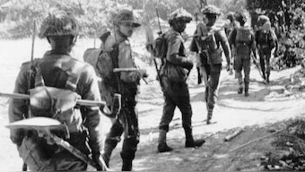 (File) In this December 7, 1971, photo, Indian troops advance inside the Northwest sector of East Pakistan. In 1971 India Pakistan fought their third war in what was then East Pakistan. Indian troops supported secessionists fighting for Bangladesh's independence from Pakistan. The war ended with the creation of Bangladesh. AP
