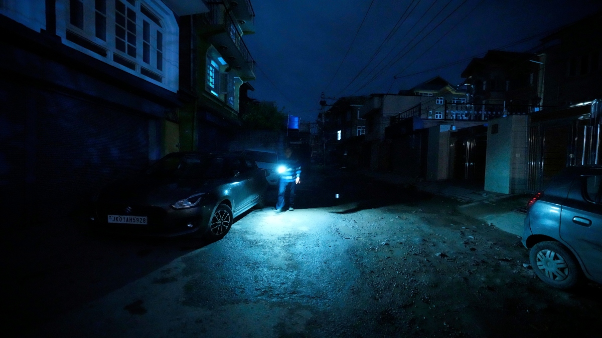 A Kashmiri man using mobile light during blackout is seen after residents of the city of Jammu reported hearing explosions and sirens in Srinagar, Indian controlled Kashmir, Thursday, on Thursday. AP A Kashmiri man using mobile light during blackout is seen after residents of the city of Jammu reported hearing explosions and sirens in Srinagar, Indian controlled Kashmir, Thursday, on Thursday. AP