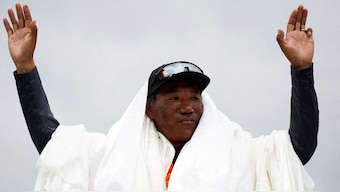 Kami Rita Sherpa, a Nepali mountaineer, waves towards the media personnel upon his arrival after climbing Mount Everest for the 28th time, creating a new record for the most summits of the world’s highest mountain, in Kathmandu, Nepal, May 25, 2023. File Image/Reuters