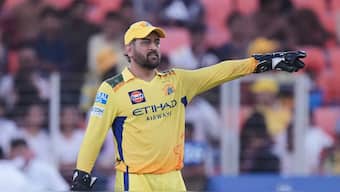 Chennai Super Kings captain MS Dhoni arranges the field during his team's away match against Gujarat Titans at the Narendra Modi Stadium in Ahmedabad on Sunday, 25 May. AP