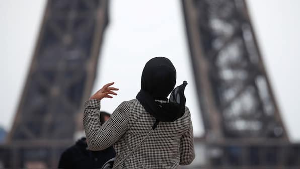 Why is France planning to ban headscarves for girls under 15 in public?
