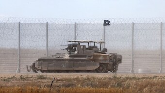 An Israeli tank takes position on Israel's border with the Gaza Srip on May 4, 2025. AFP Photo