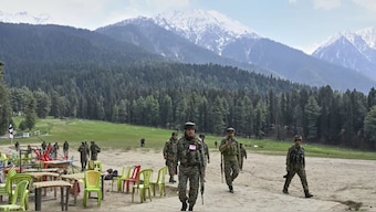 Indian security officers inspect the site in Pahalgam where militants indiscriminately opened fired at tourists at Pahalgam. AP File