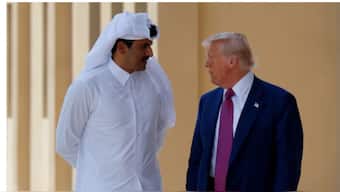 U.S. President Donald Trump talks with Qatar's Emir Tamim bin Hamad Al Thani as he departs Al Udeid Air Base, en-route to Abu Dhabi, United Arab Emirates, in Doha, Qatar, May 15, 2025. REUTERS