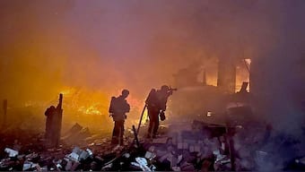 This handout photograph taken and released by Ukrainian State Emergency Service Press Service on May 25, 2025 shows firefighters operating on burning houses following Russian strike in Kyiv region, amid Russian invasion in Ukraine. AFP Photo