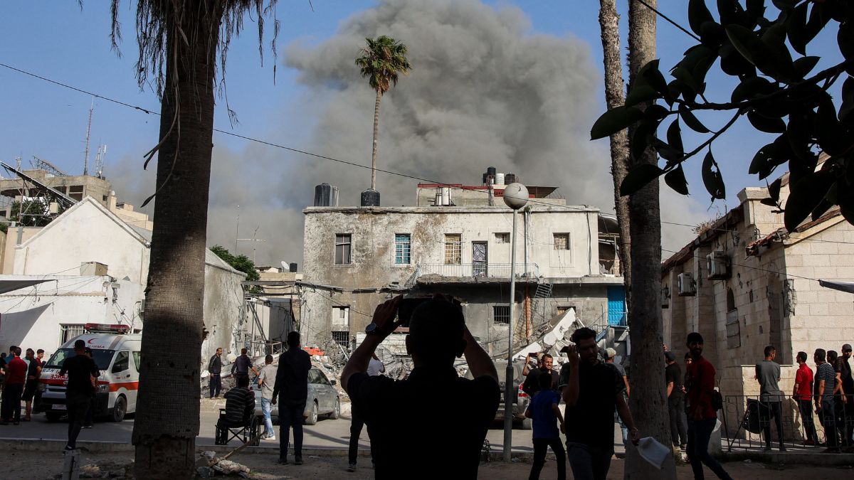 This picture taken from the grounds of the Ahli Arab Hospital, also known as the Maamadani (Baptist) Hospital, shows a cloud of smoke erupting following Israeli bombardment on a building in the Daraj neighbourhood of Gaza City on May 31, 2025. (AFP) This picture taken from the grounds of the Ahli Arab Hospital, also known as the Maamadani (Baptist) Hospital, shows a cloud of smoke erupting following Israeli bombardment on a building in the Daraj neighbourhood of Gaza City on May 31, 2025. (AFP)
