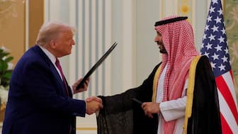 US President Donald Trump and Saudi Crown Prince and Prime Minister Mohammed Bin Salman shake hands during a Memorandum of Understanding (MOU) signing ceremony at the Royal Court in Riyadh, Saudi Arabia, on Tuesday. Reuters