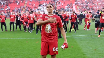 Trent Alexander-Arnold celebrates at the Anfield following Liverpool's 5-1 thrashing of Tottenham Hotspur, which confirmed their 20th English top-flight title. Reuters