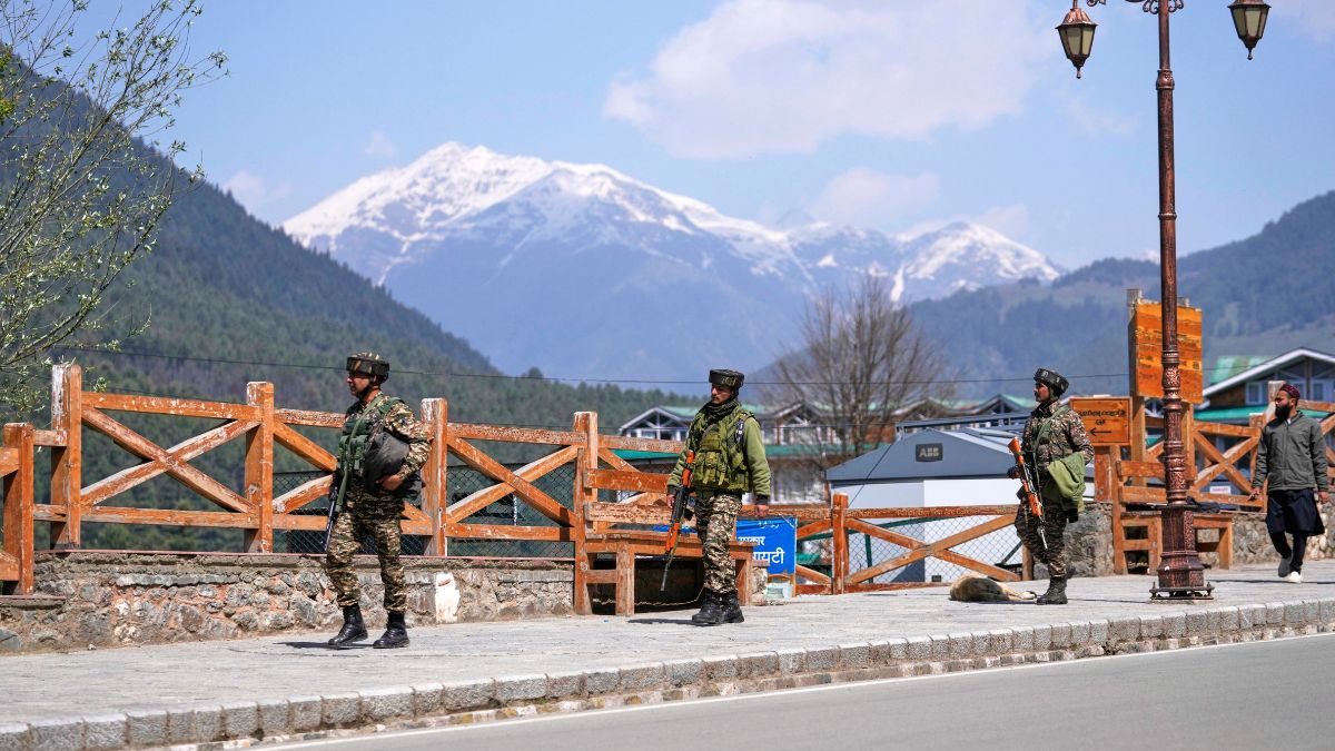 Security personnel patrol a street the morning after terrorists indiscriminately opened fire on tourists near Pahalgam in Kashmir, April 23, 2025. AP Security personnel patrol a street the morning after terrorists indiscriminately opened fire on tourists near Pahalgam in Kashmir, April 23, 2025. AP