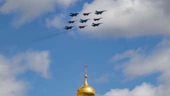Russian Sukhoi Su-30SM fighter jets and MiG-29 fighter jets fly over Ivan the Great Bell Tower of the Kremlin during a rehearsal for the Victory Day military parade in central Moscow on May 5, 2025. AFP
