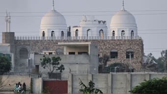 Local residents stand outside a mosque of an Islamic seminary partially damaged by an Indian missile attack, outskirts of Bahawalpur, Pakistan, May 7, 2025. AP