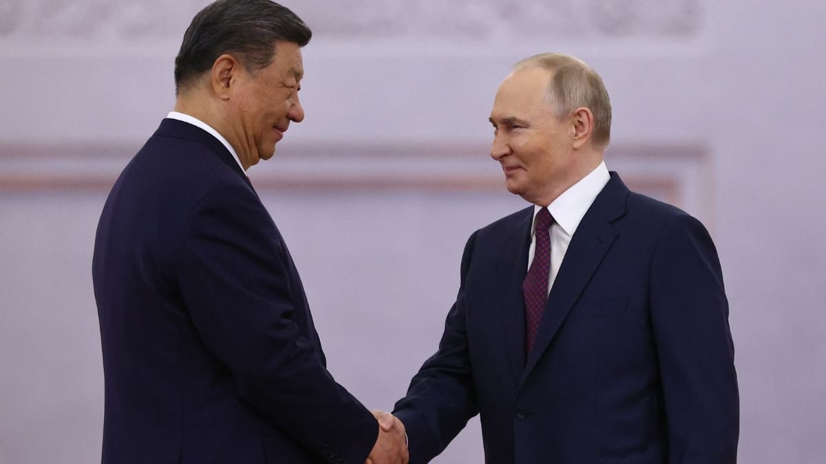 China says it stands alongside Russia against "hegemonic bullying" as Xi meets Putin