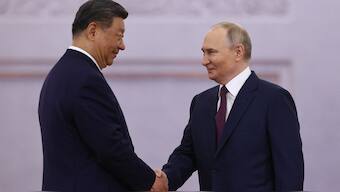 Russian President Vladimir Putin and his Chinese counterpart Xi Jinping shake hands during a welcoming ceremony before their talks at the Kremlin in Moscow on May 8, 2025. AFP File