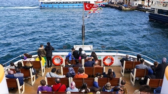 Tourists and commuters sail through Bosphorus on a ferry in Istanbul, Turkey, April 23, 2025. File Photo/Reuters
