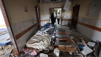 Palestinians inspect the destruction inside Nasser hospital in Khan Yunis in the southern Gaza Strip following an Israeli strike early on May 13, 2025. AFP