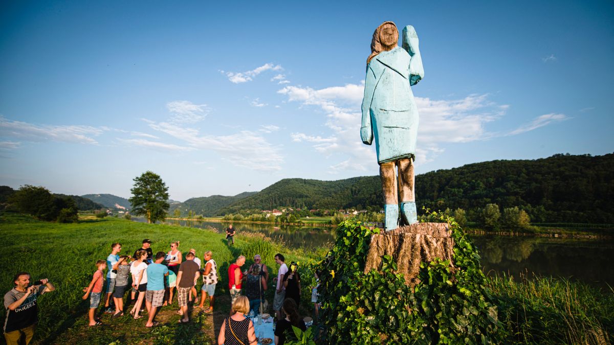 People gather around what conceptual artist Ales 'Maxi' Zupevc claims is the first ever monument of Melania Trump, set in the fields near the town of Sevnica, US First Lady’s hometown. AFP People gather around what conceptual artist Ales 'Maxi' Zupevc claims is the first ever monument of Melania Trump, set in the fields near the town of Sevnica, US First Lady’s hometown. AFP