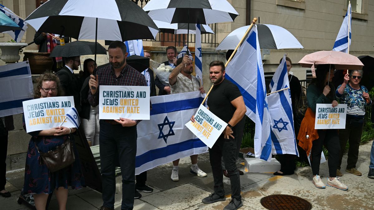 People hold signs and Israeli national flags in a sign of support outside the Capital Jewish Museum following a shooting that left two people dead, in Washington, DC, on May 22, 2025. AFP People hold signs and Israeli national flags in a sign of support outside the Capital Jewish Museum following a shooting that left two people dead, in Washington, DC, on May 22, 2025. AFP